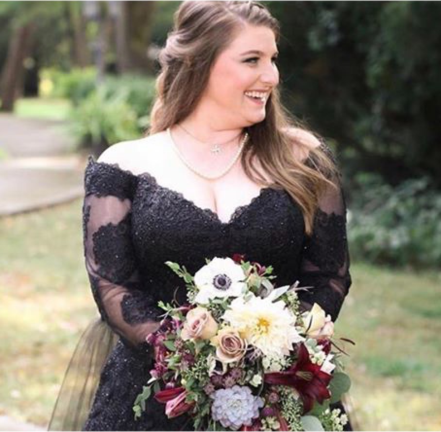 Model in a black dress with flowers